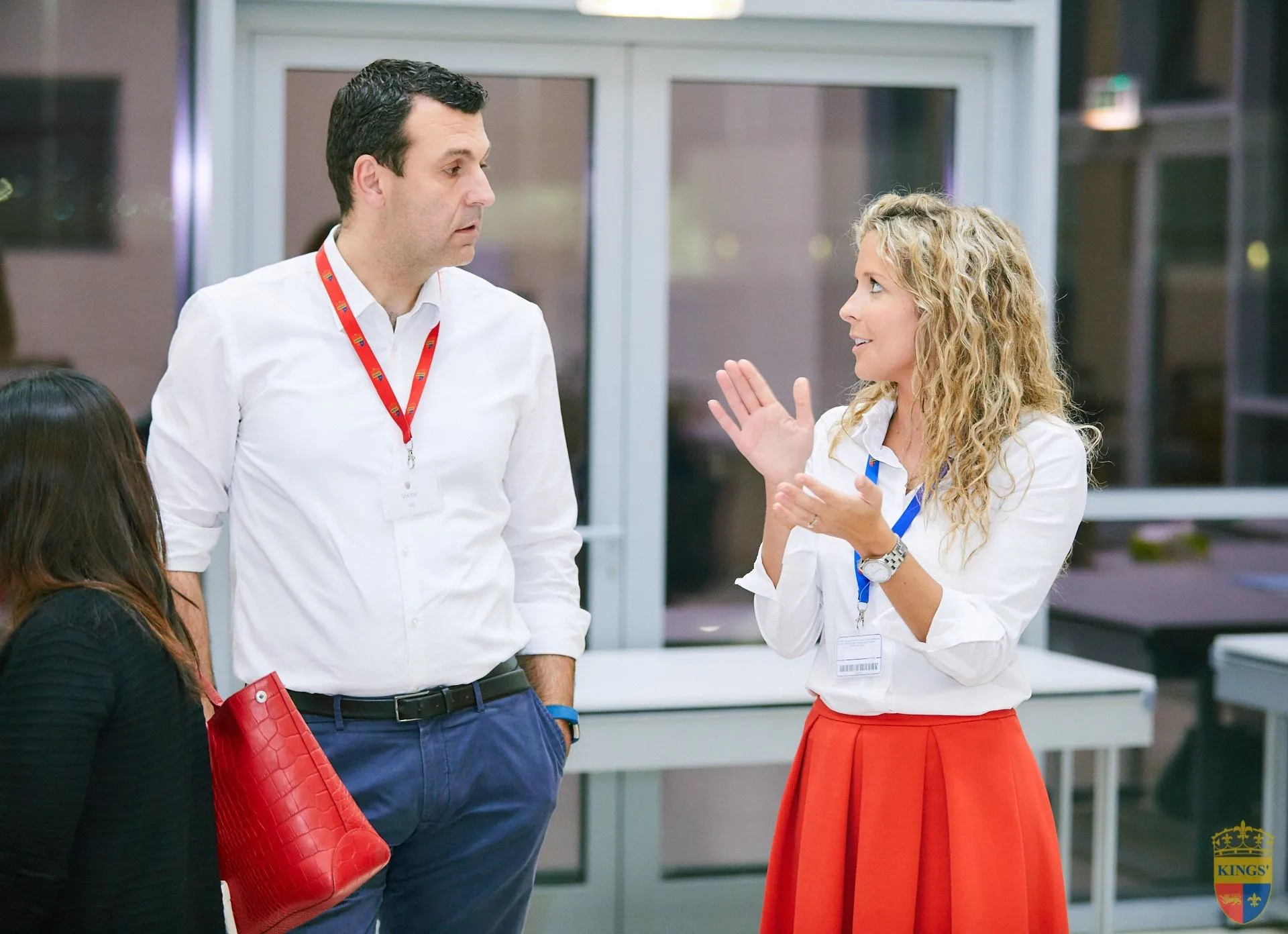 Katherine discussing a classroom activity with a colleague