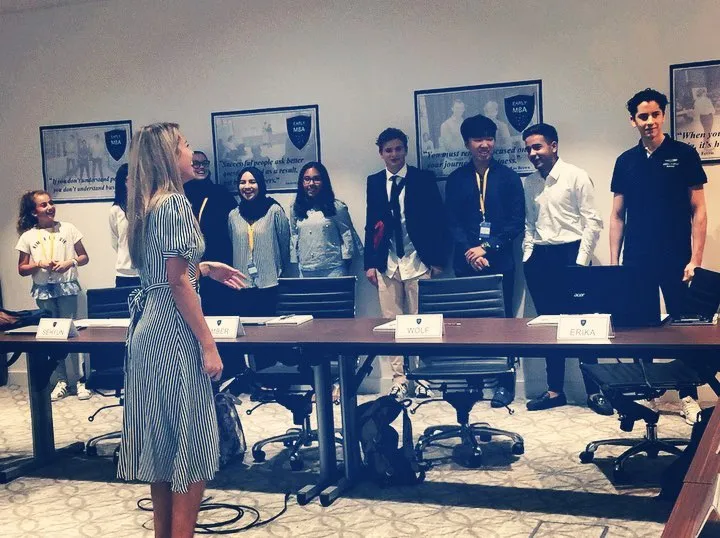 Katherine with students at a business workshop